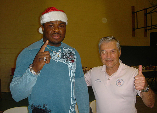 Heavyweight contender Samuel Peters and Ron Ross giving out Christmas gifts to kids at Deerfield Beach Boys Club, 2010